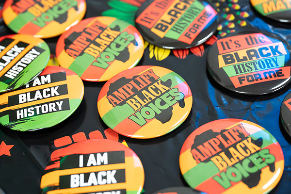 Closeup of various pin-on buttons that read 