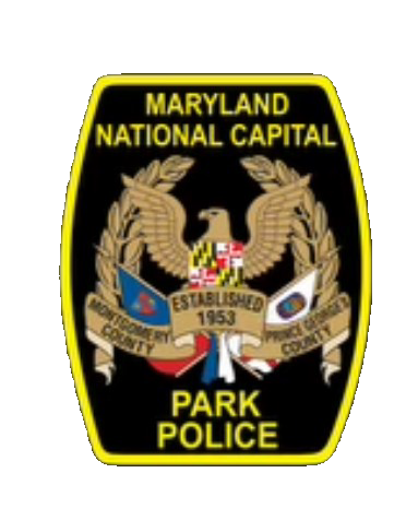Maryland-National Capital Park Police badge featuring an eagle, laurel wreaths, Maryland flag shield, and “Established 1953” on a black background.